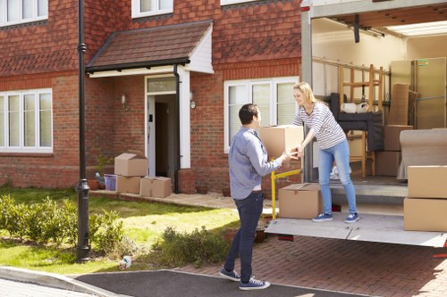 Removal team planning a flat move in Barnet with boxes and furniture