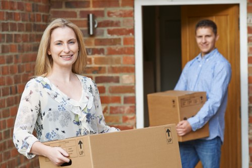 Removal team planning a house move on a residential street in Barnet