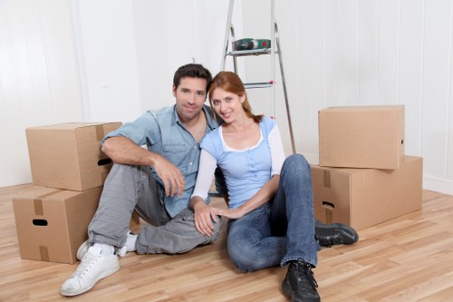 Barnet Movers workers maintaining safety in an occupied property