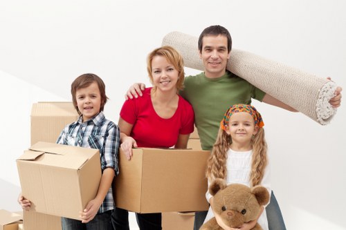 Professional movers handling furniture and access issues in a Barnet property