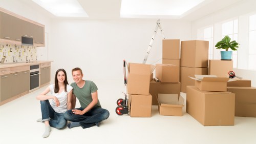 Removal team loading boxes and furniture for a Barnet home move